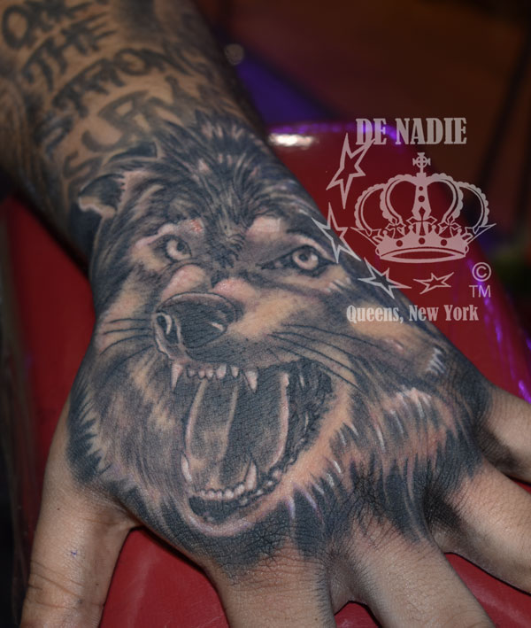 Wolf hand tattoo